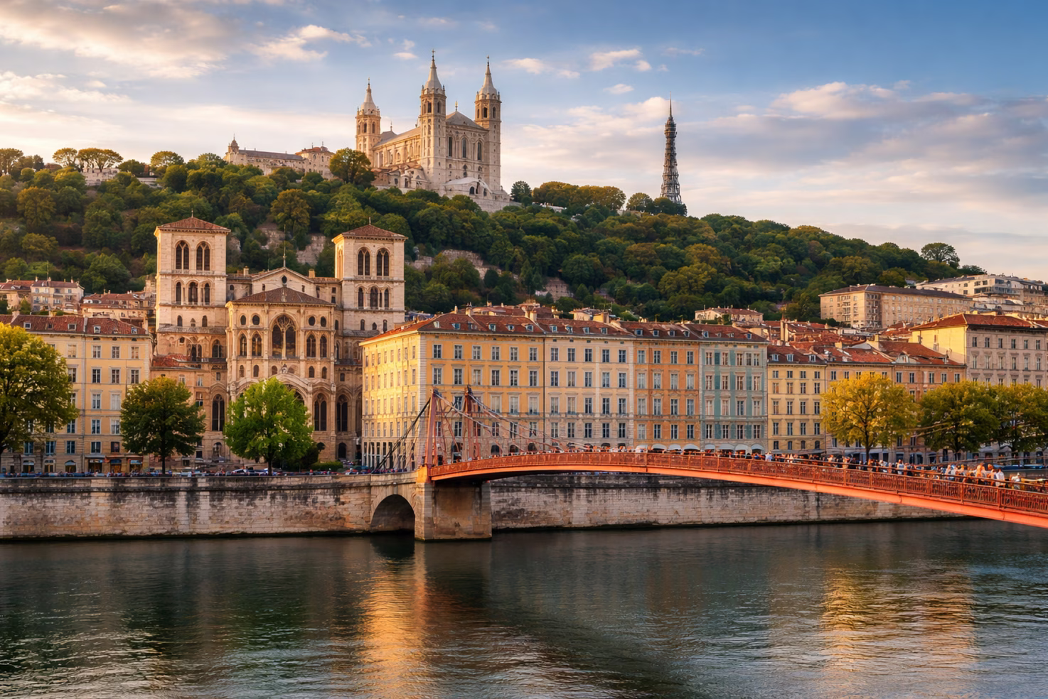 The Saône riverfront in Lyon with the Fourvière basilica at sunset
